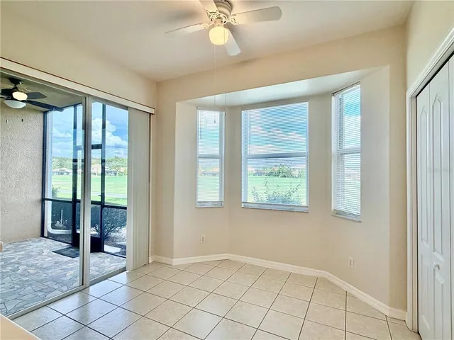 a kitchen with stainless steel appliances a stove top oven a sink a refrigerator with white cabinets