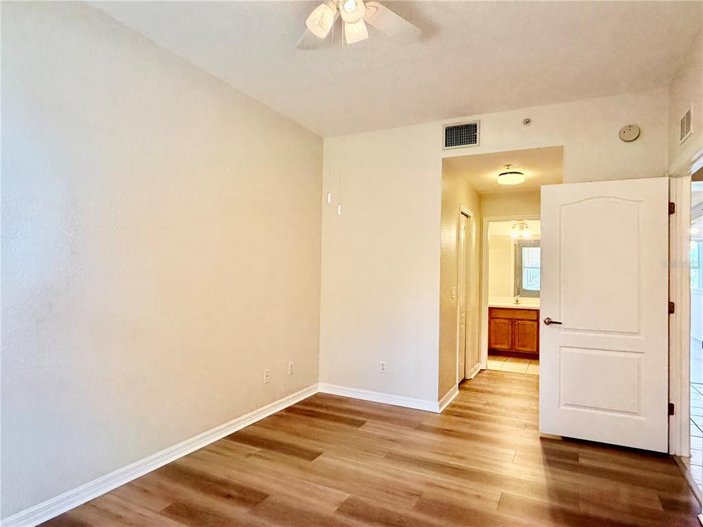 819 Fairwaycove Lane, Unit 102 Bradenton, FL 34212 - Photo 24 of 56 a view of a livingroom with wooden floor