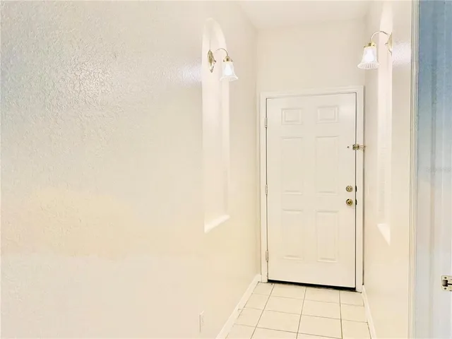 a view of a large kitchen with wooden floor and a window