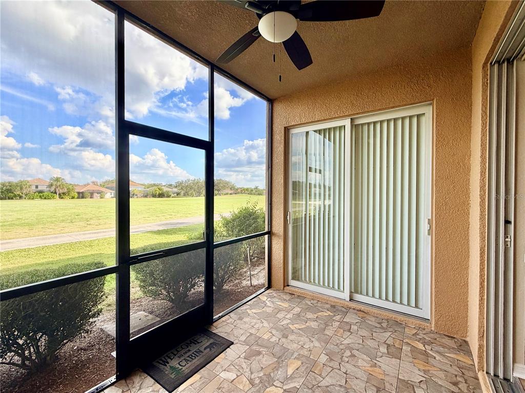 819 Fairwaycove Lane, Unit 102 Bradenton, FL 34212 - Photo 38 of 56 a view of a room with a floor to ceiling window and an outdoor view