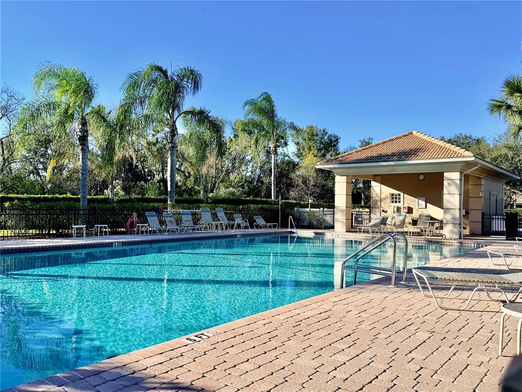819 Fairwaycove Lane, Unit 102 Bradenton, FL 34212 - Photo 42 of 56 a view of a house with a yard and sitting area