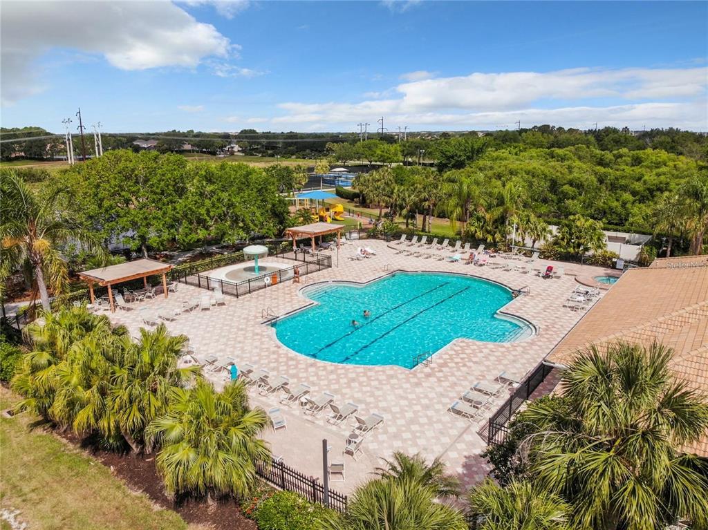 819 Fairwaycove Lane, Unit 102 Bradenton, FL 34212 - Photo 45 of 56 a view of a swimming pool with a yard