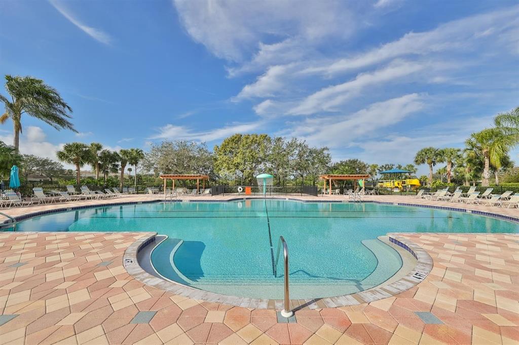 819 Fairwaycove Lane, Unit 102 Bradenton, FL 34212 - Photo 46 of 56 a view of a swimming pool from a balcony