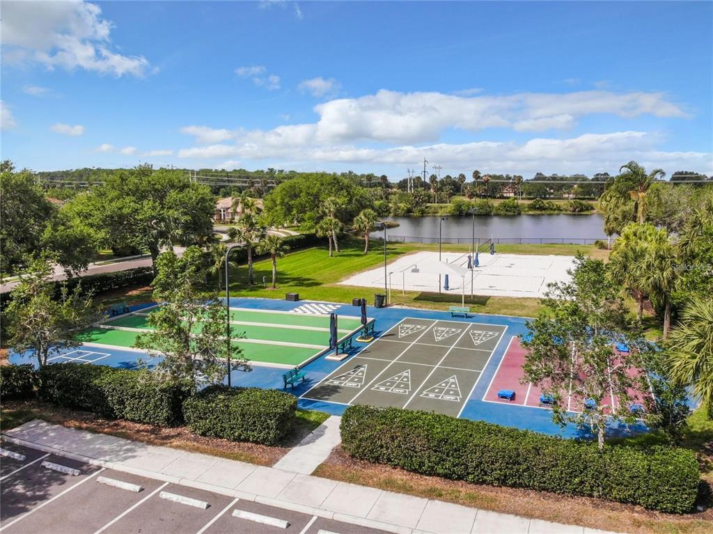 819 Fairwaycove Lane, Unit 102 Bradenton, FL 34212 - Photo 52 of 56 a view of a lake with houses in the back