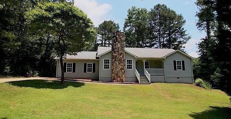 100 Mays Landing Road Stockbridge, GA 30281 - Photo 1 of 1 a front view of house with yard and trees in the background
