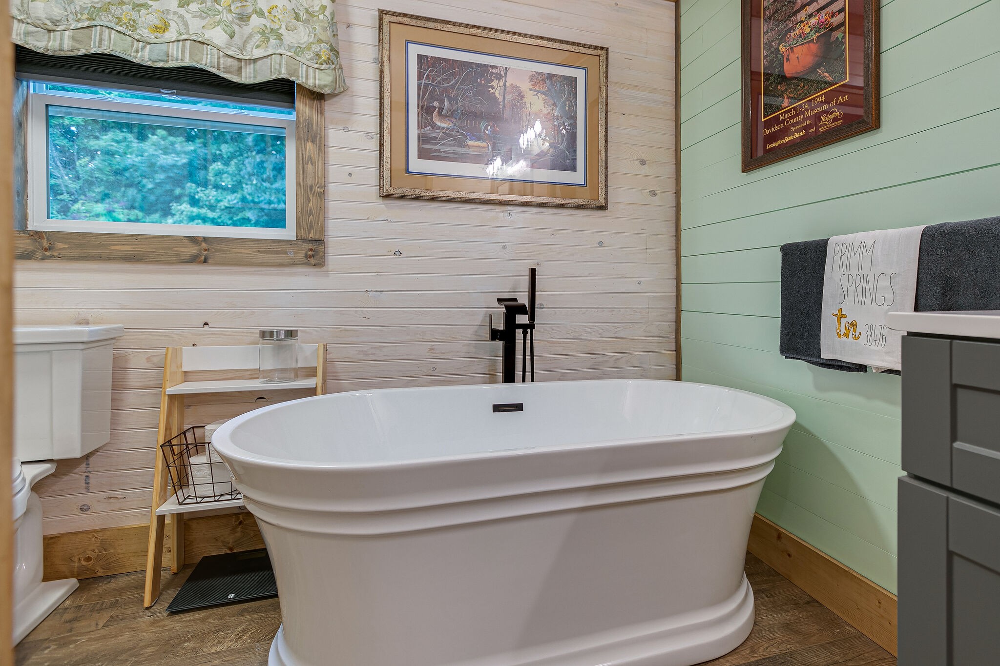 7791 Lampley Road Primm Springs, TN 38476 - Photo 23 of 32 a white bath tub sitting in a bathroom
