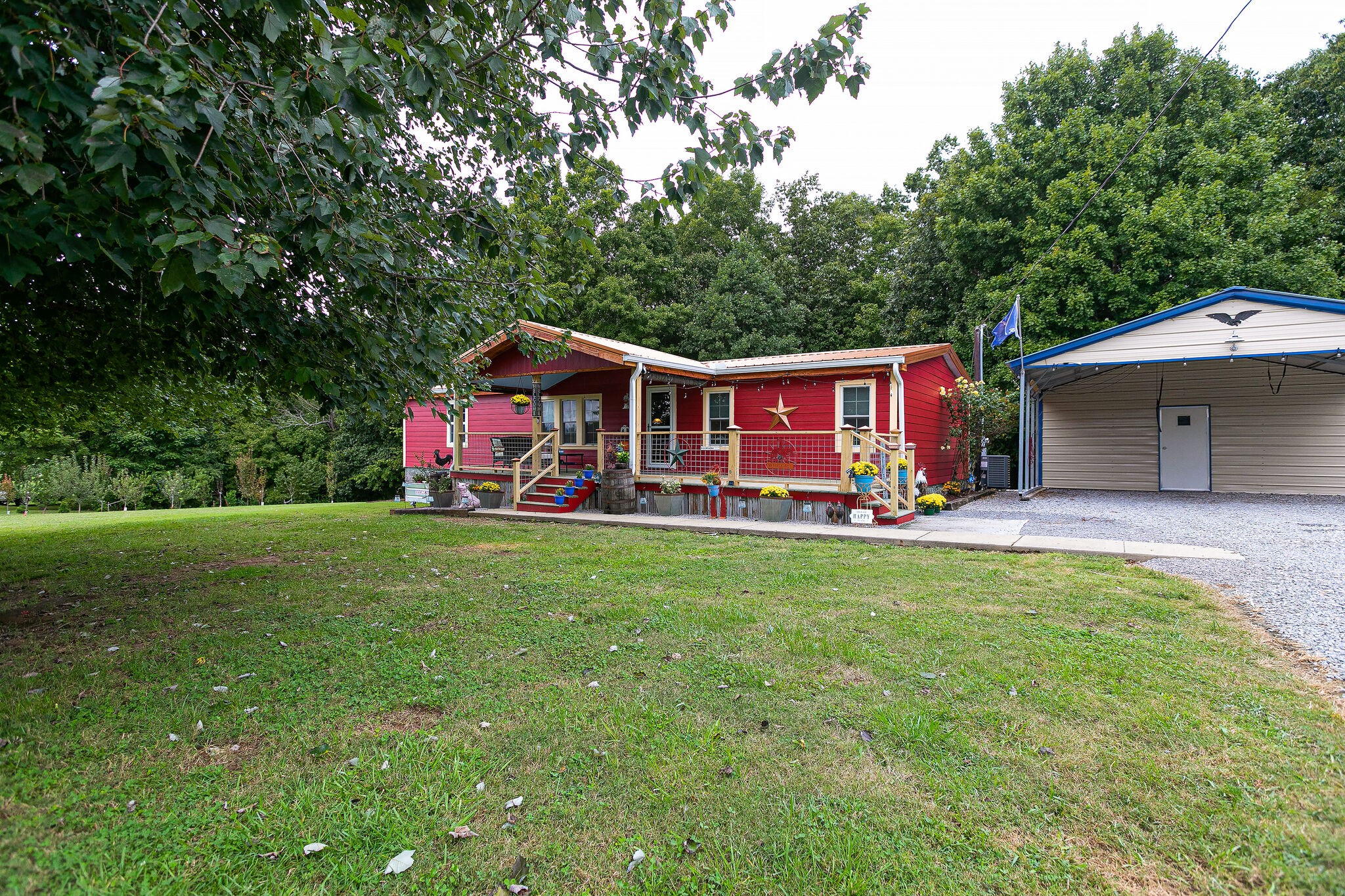 7791 Lampley Road Primm Springs, TN 38476 - Photo 5 of 32 a view of a house with a yard balcony and sitting area