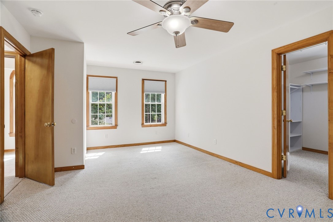 14420 Branding Iron Road Chesterfield, VA 23838 - Photo 24 of 50 Spacious room featuring neutral carpeting, two win