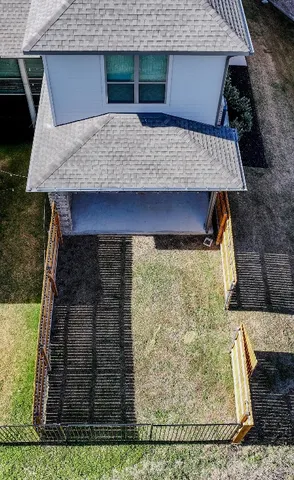 a aerial view of a house with large trees
