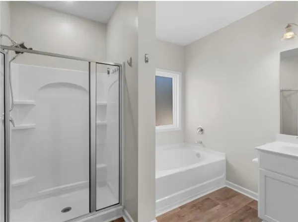 a bathroom with a bathtub and a shower