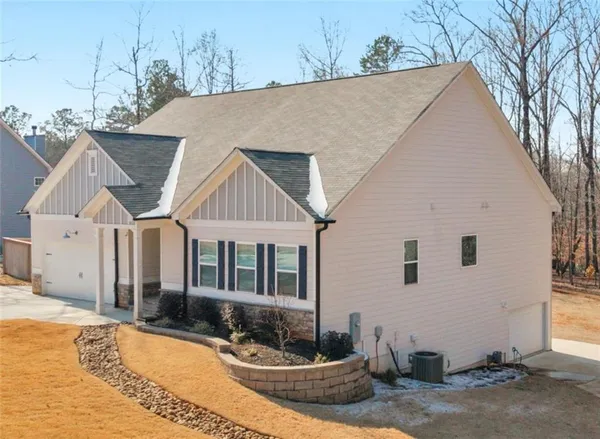 a view of house with yard