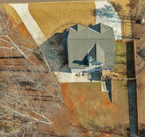 a aerial view of a house with swimming pool