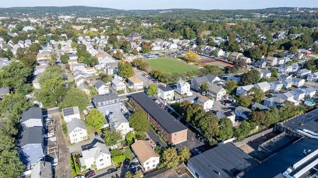 an aerial view of residential houses with outdoor space