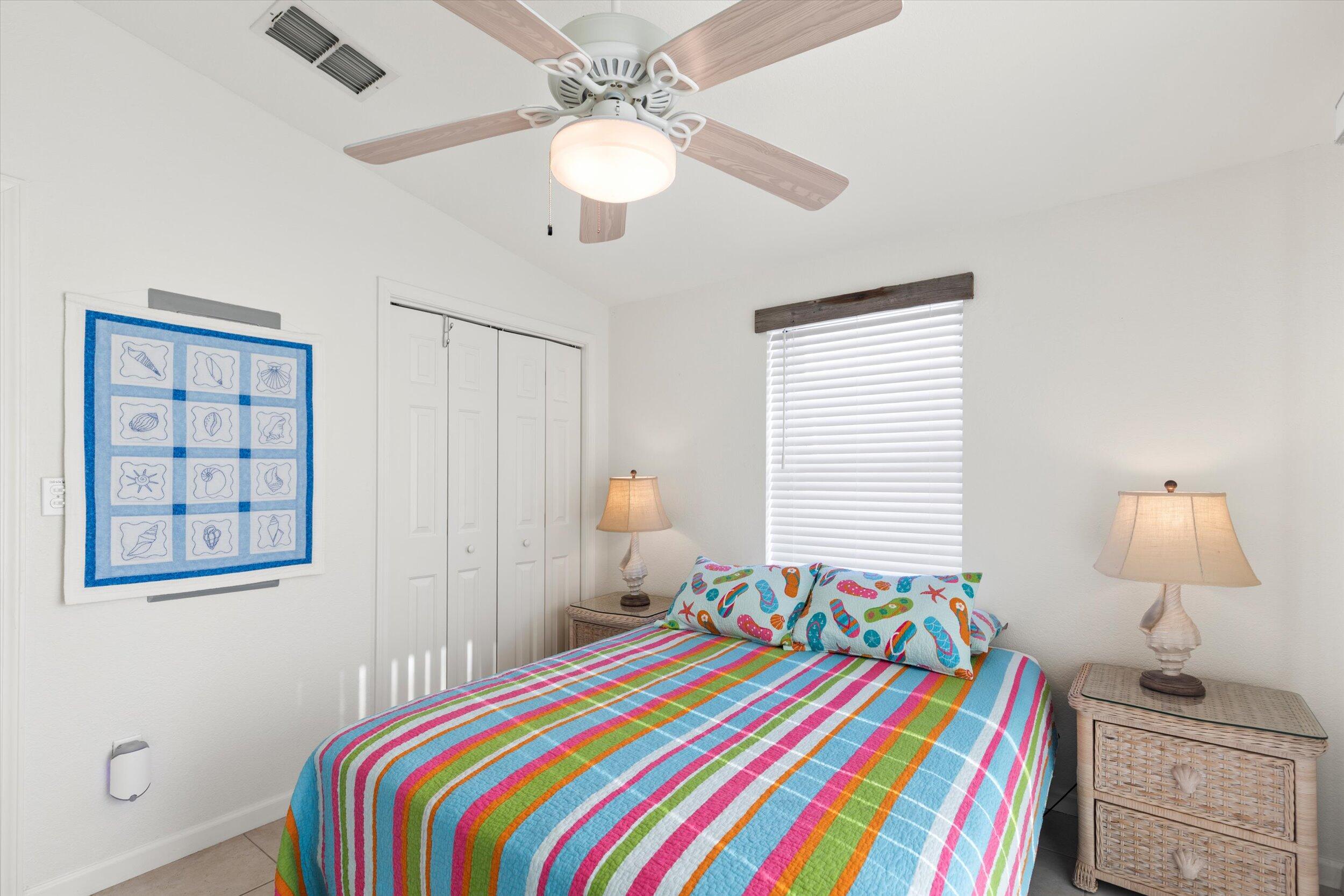 157 Mars Lane Key West, FL 33040 - Photo 25 of 41 a bedroom that has a bed and a chandelier