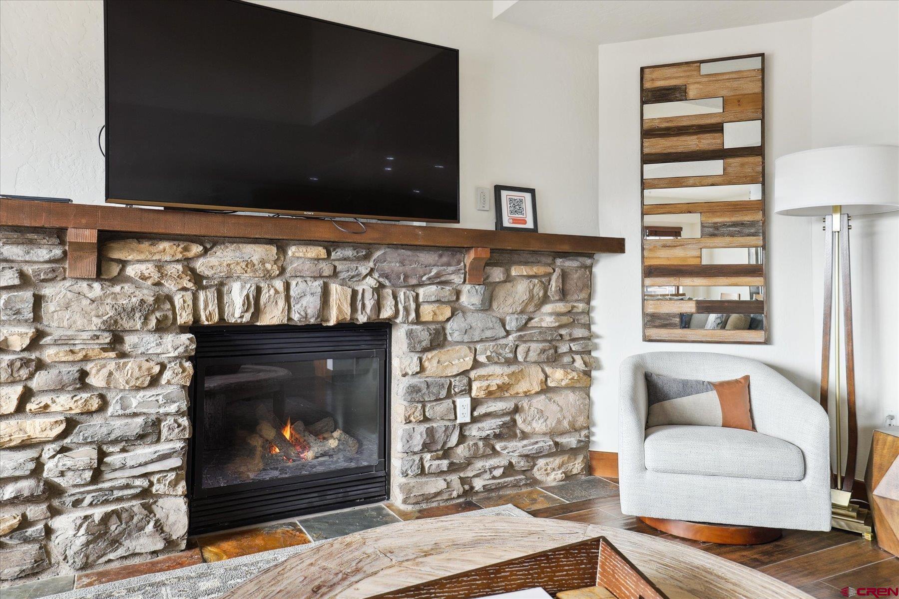 24 Sheol Street, Unit R505 Durango, CO 81301 - Photo 12 of 36 a living room with a fireplace and a fireplace