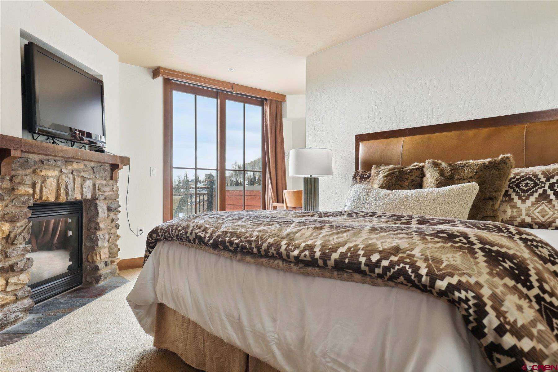 24 Sheol Street, Unit R505 Durango, CO 81301 - Photo 17 of 36 a bedroom with bed and flat screen tv