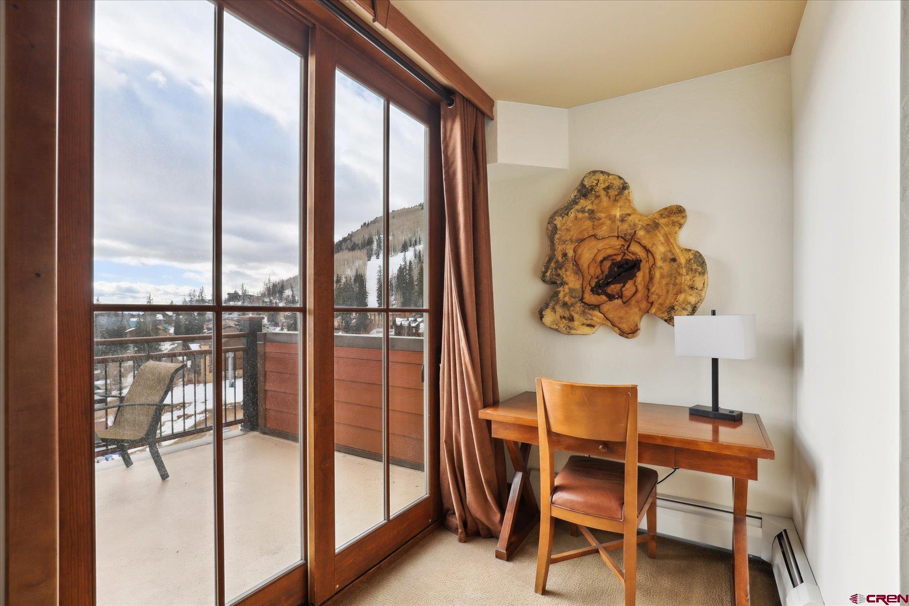 24 Sheol Street, Unit R505 Durango, CO 81301 - Photo 18 of 36 a dining room with furniture and a floor to ceiling window