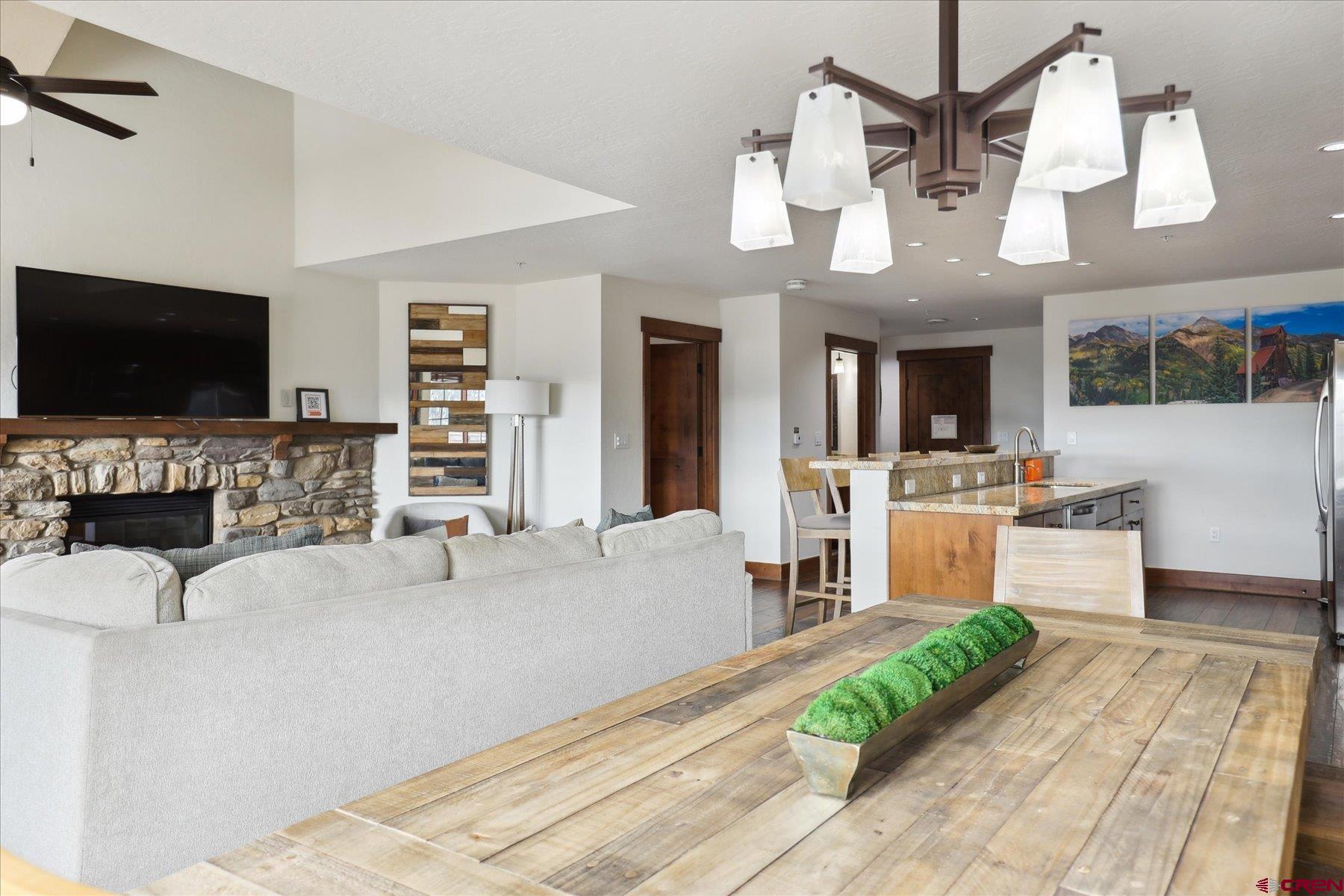 24 Sheol Street, Unit R505 Durango, CO 81301 - Photo 10 of 36 a living room with fireplace furniture and a flat screen tv