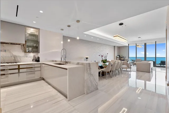 a kitchen with lots of counter top space and living room