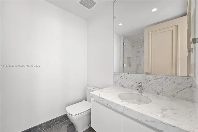 a bathroom with a sink and a toilet