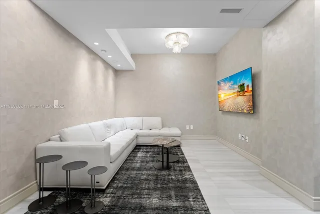 a living room with furniture and a rug