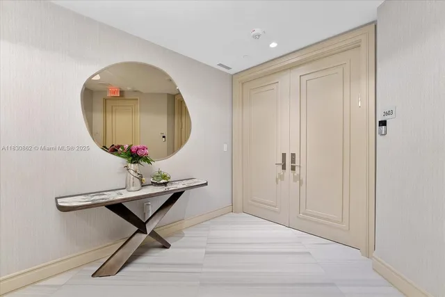 a workspace room with furniture and mirror