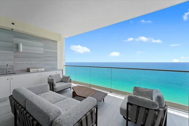 a view of a dining room with furniture and a window