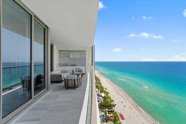 a balcony with view of swimming pool