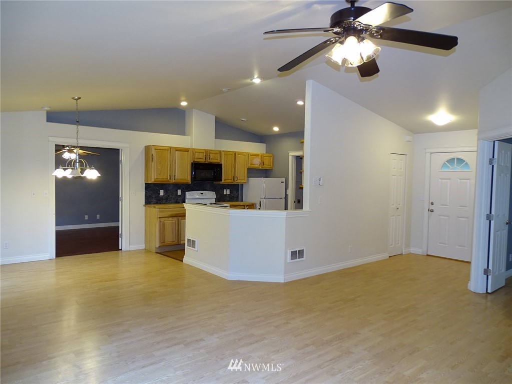 301 Harbor View Loop Southeast Ocean Shores, WA 98569 - Photo 12 of 29 a view of a kitchen with a sink and microwave