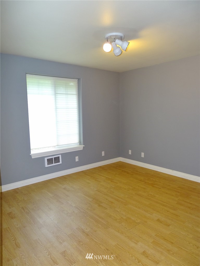 301 Harbor View Loop Southeast Ocean Shores, WA 98569 - Photo 21 of 29 a view of an empty room with a window