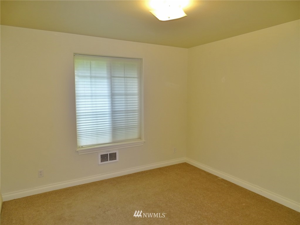 301 Harbor View Loop Southeast Ocean Shores, WA 98569 - Photo 26 of 29 a view of an empty room with a window
