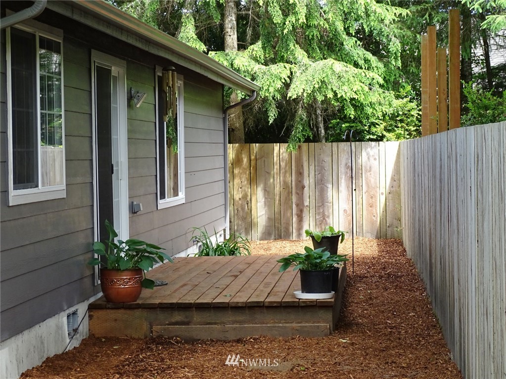 301 Harbor View Loop Southeast Ocean Shores, WA 98569 - Photo 6 of 29 a view of a house with a potted plant