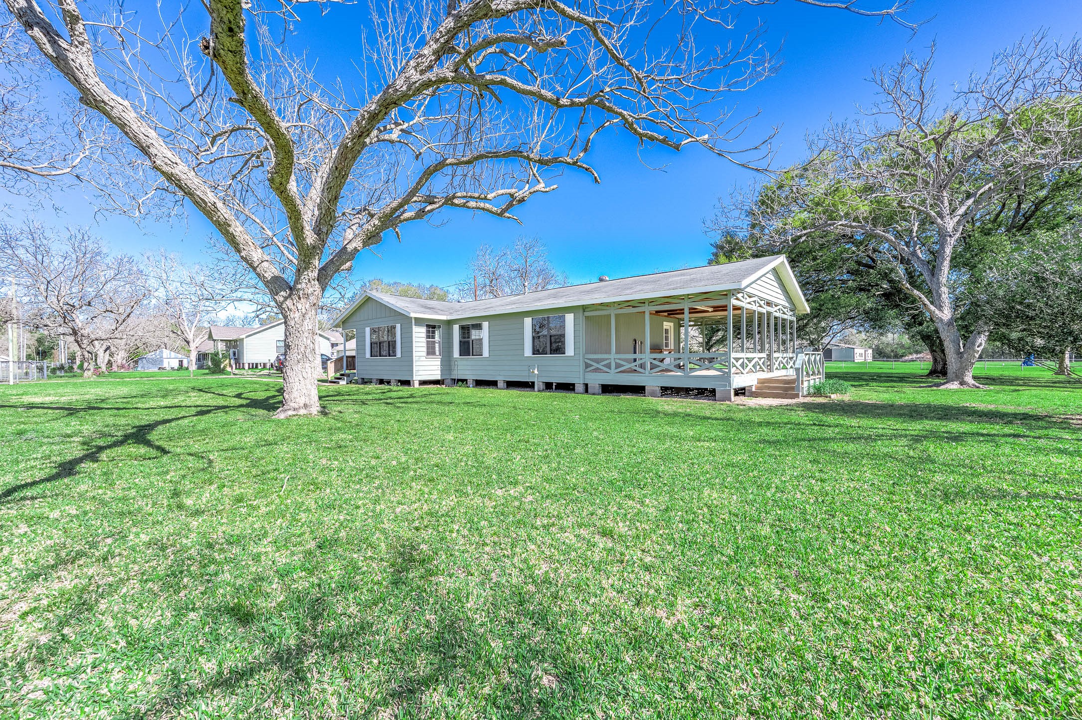 2474 Gates Road Alvin, TX 77511 - Photo 7 of 37 VIEW OF HOME SHOWING THE LARGE PORCH TO THE SIDE