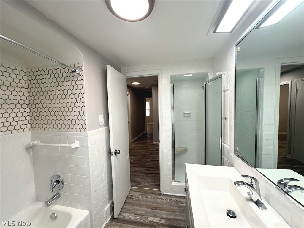 4227 Eastway Road South Euclid, OH 44121 - Photo 13 of 18 Bathroom featuring hardwood / wood-style flooring, combined bath / shower with glass door, and sink