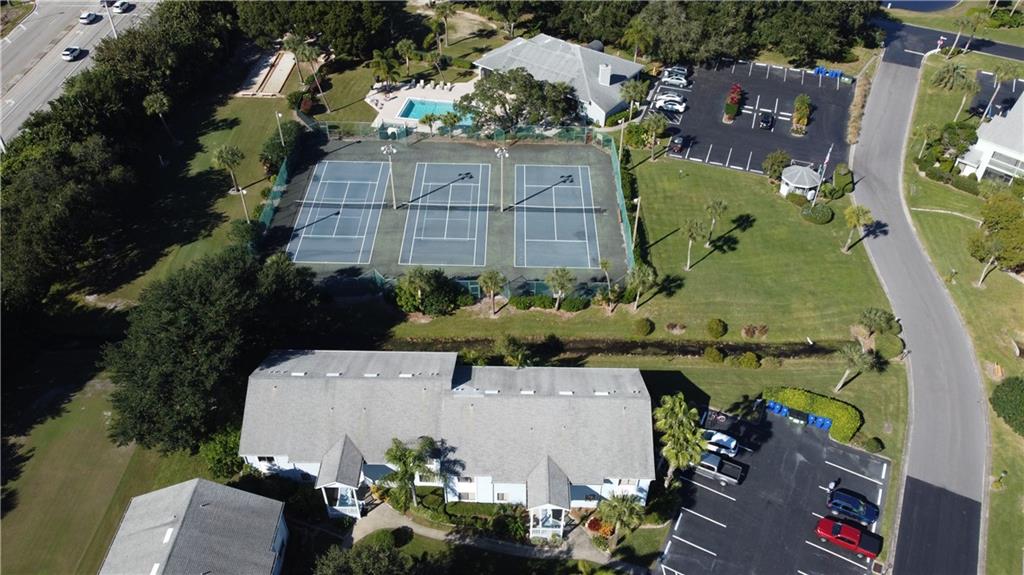 9641 Riverside Drive, Unit 1 Sebastian, FL 32958 - Photo 8 of 36 an aerial view of a house with a garden and lake view
