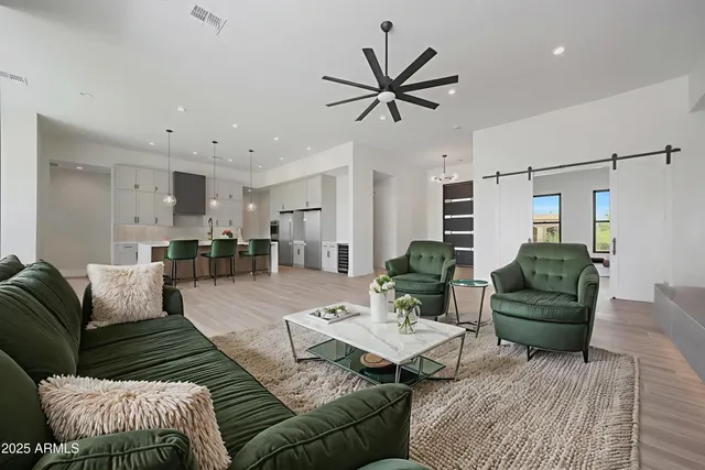 a spacious bedroom with a bed and a large window