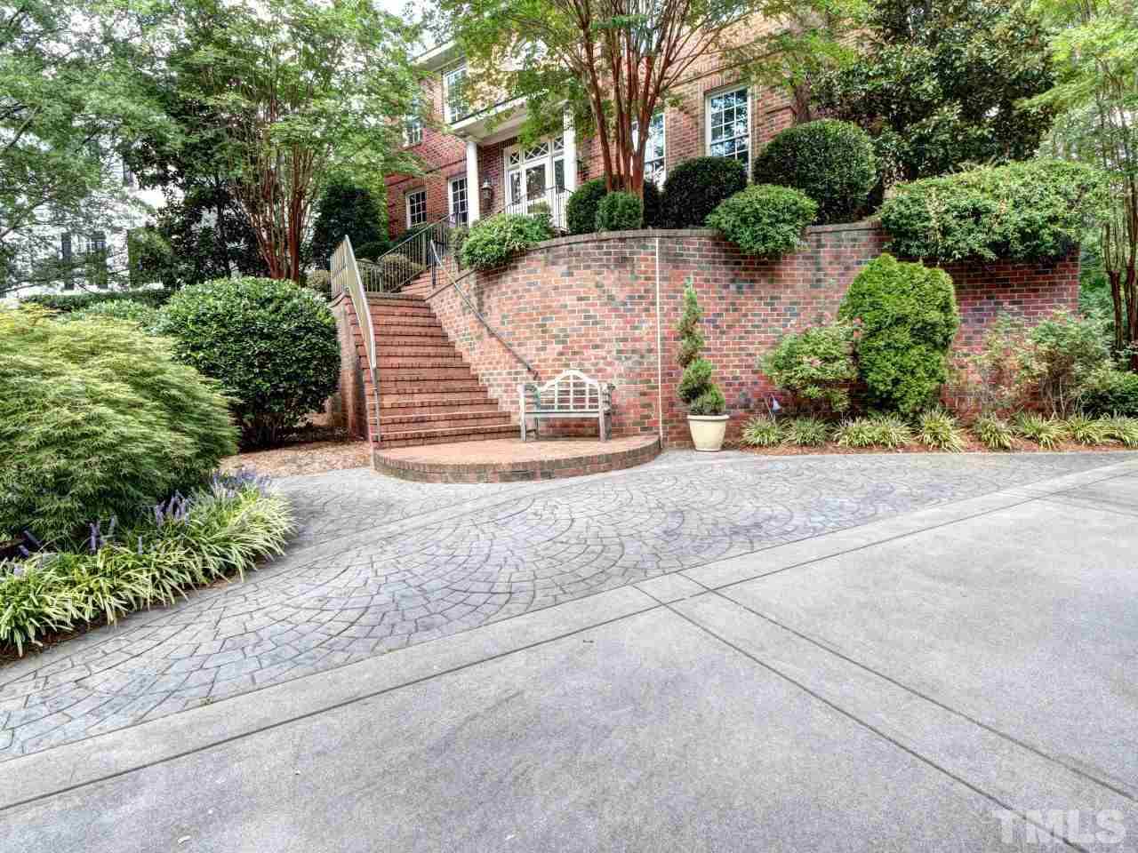 302 Marlowe Road Raleigh, NC 27609 - Photo 2 of 25 All brick stairs with wrought iron railings, stamped concrete parking pad