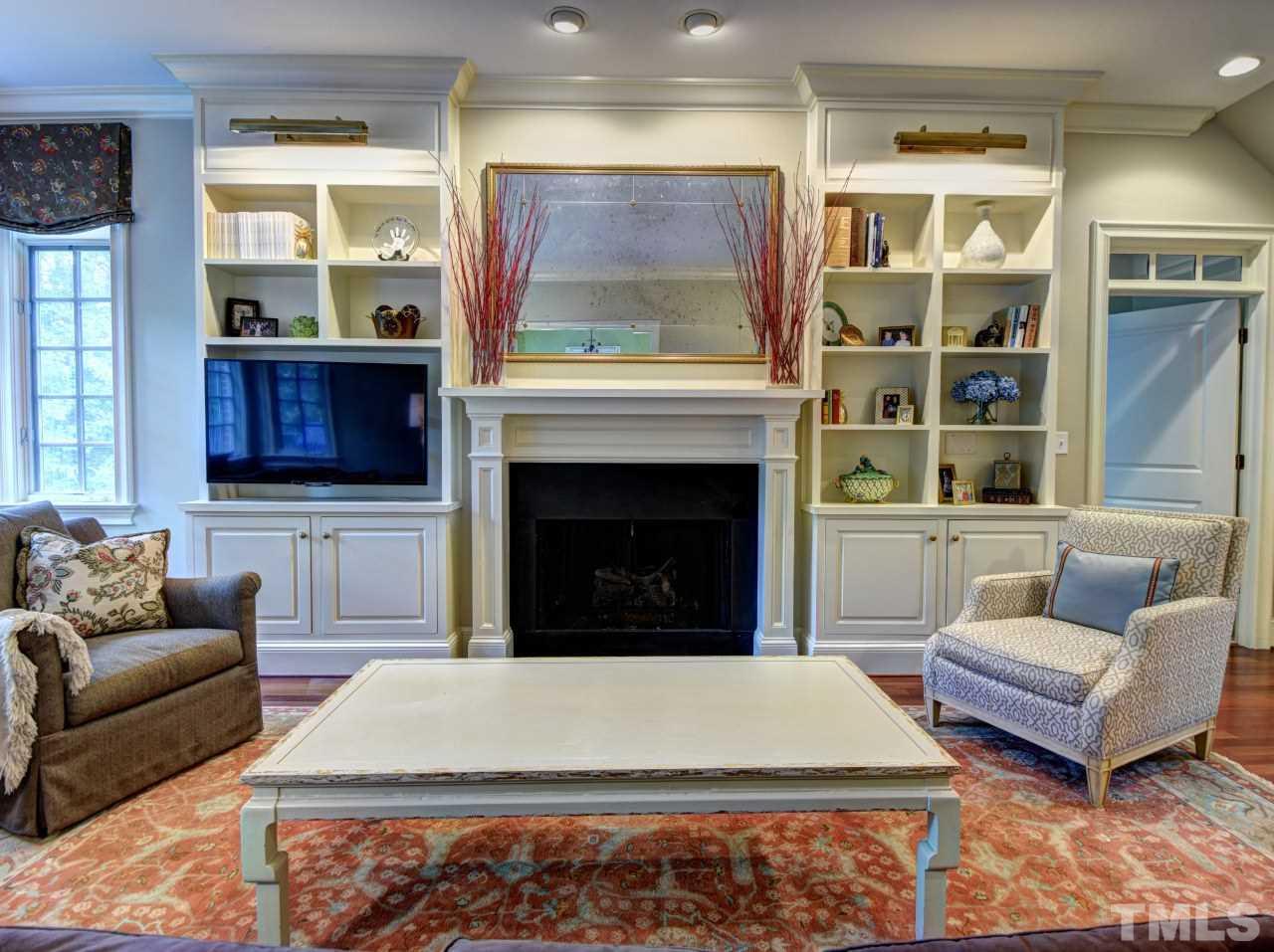 302 Marlowe Road Raleigh, NC 27609 - Photo 9 of 25 Built-in bookcases with lighting, custom FP mantle, gas logs.