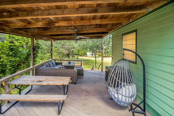 a backyard of a house with outdoor seating