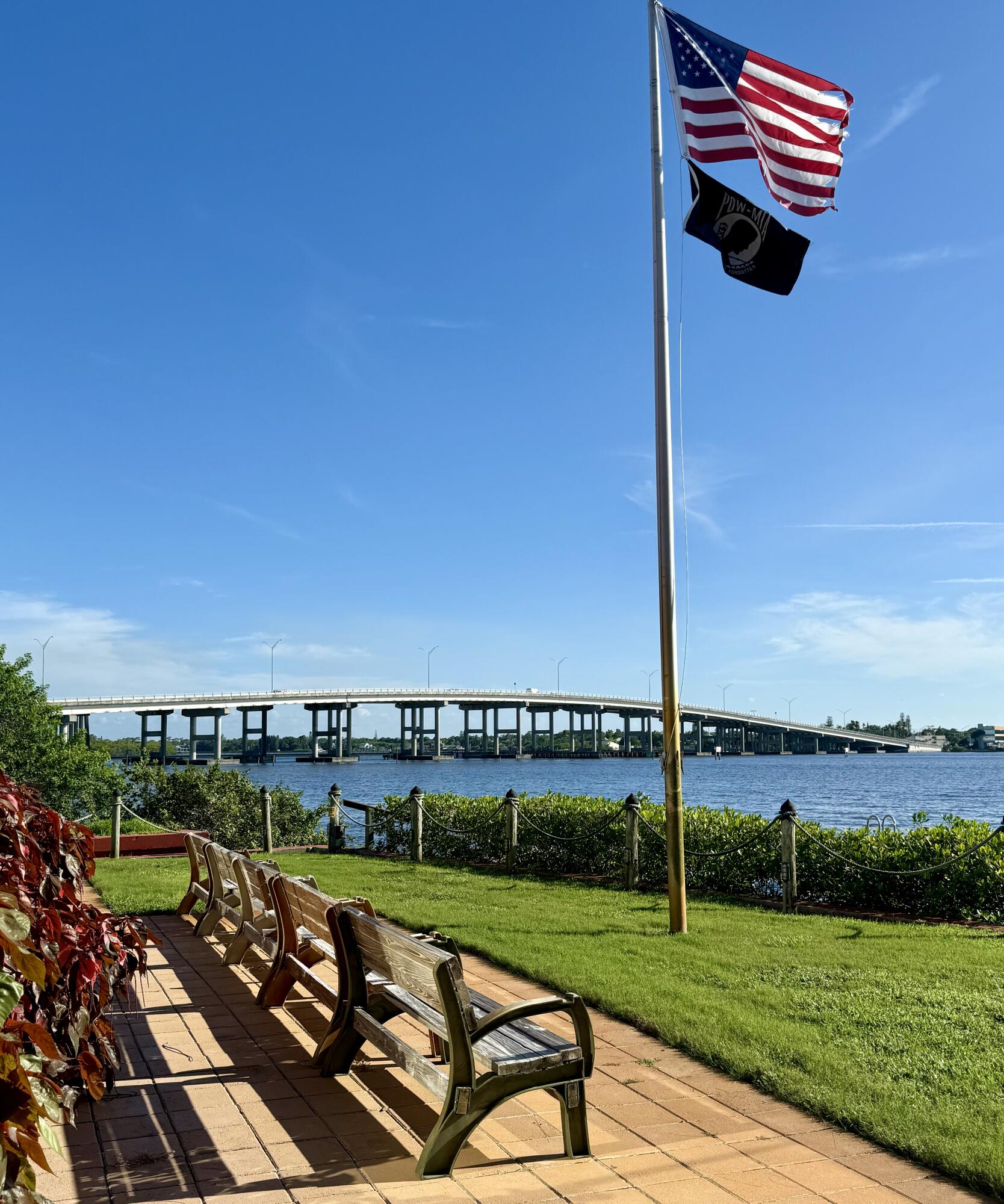 a view of a swimming pool with a yard and lake view