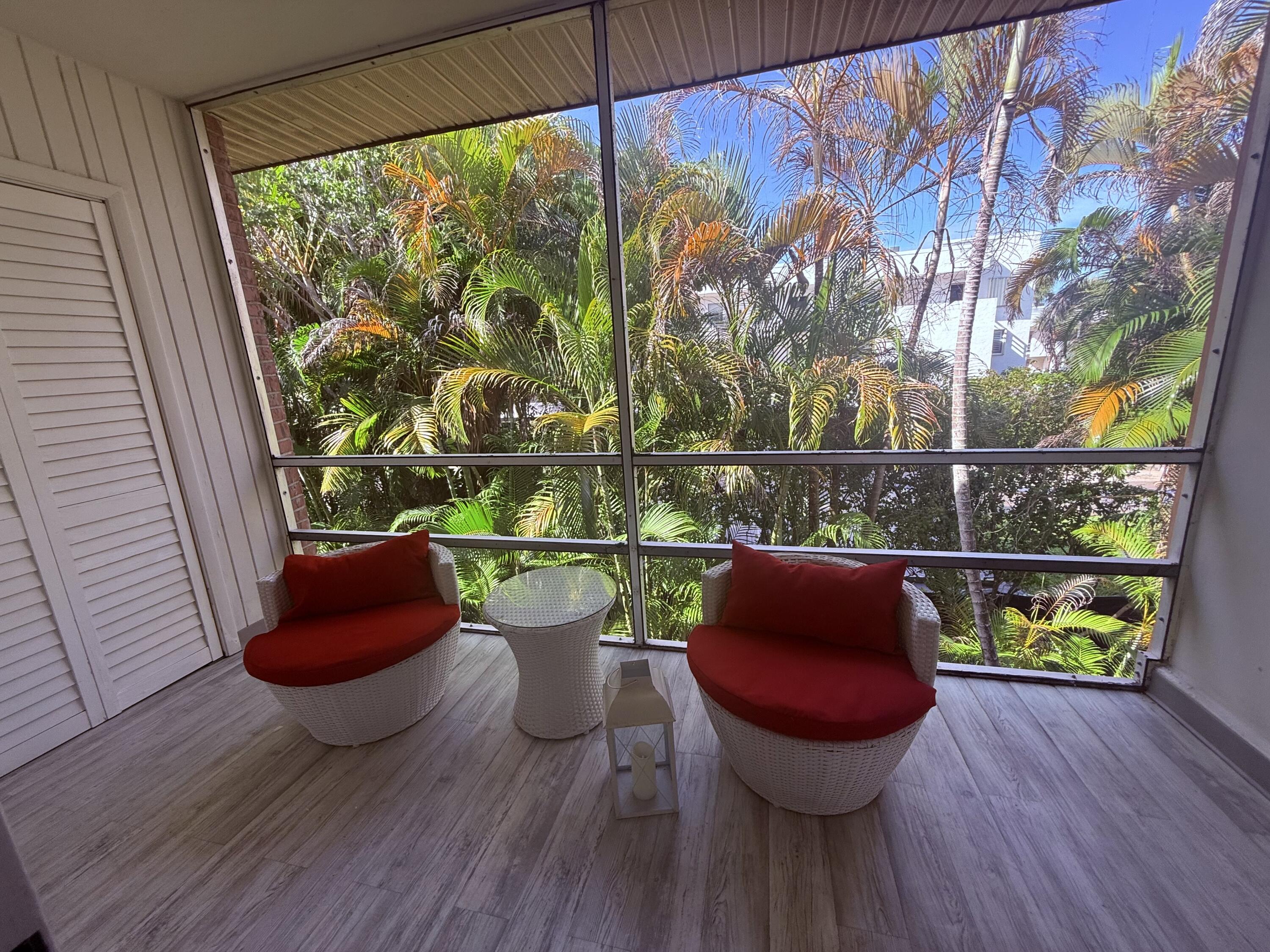 1982 Southwest Palm City Road, Unit F Stuart, FL 34994 - Photo 20 of 34 a room with furniture and a potted plant