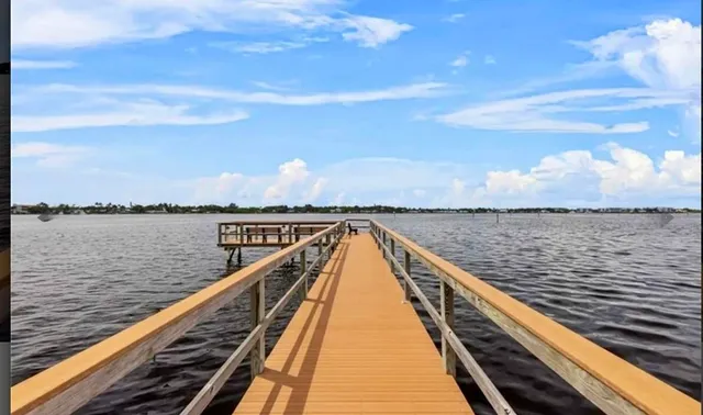 a view of a balcony with wooden floor