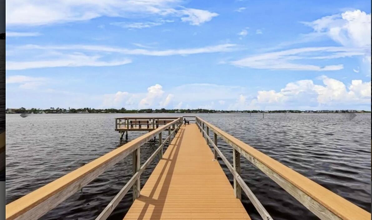 1982 Southwest Palm City Road, Unit F Stuart, FL 34994 - Photo 2 of 34 a view of a balcony with wooden floor