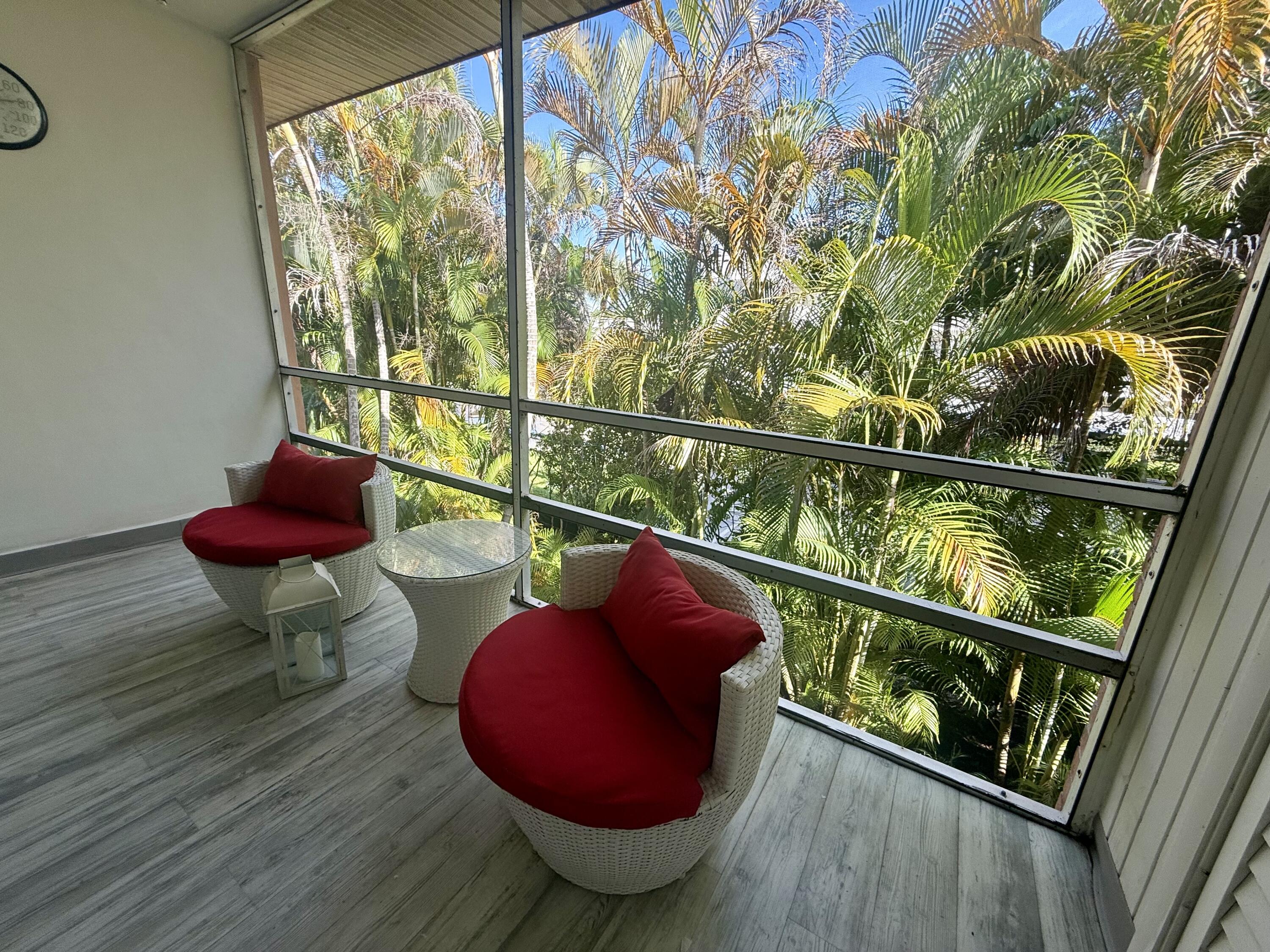 1982 Southwest Palm City Road, Unit F Stuart, FL 34994 - Photo 22 of 34 a room with wooden floor