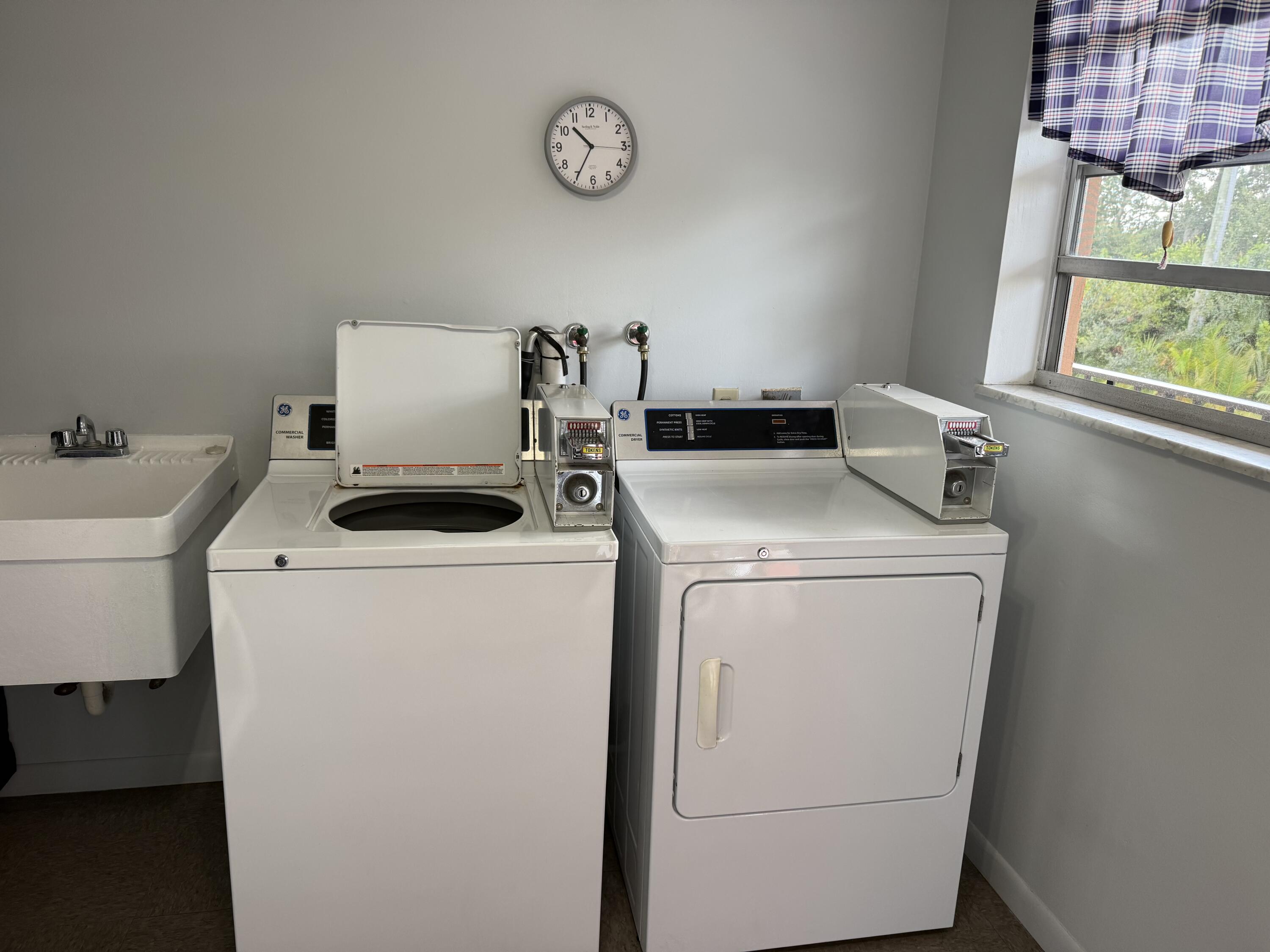 1982 Southwest Palm City Road, Unit F Stuart, FL 34994 - Photo 23 of 34 a utility room with dryer and washer