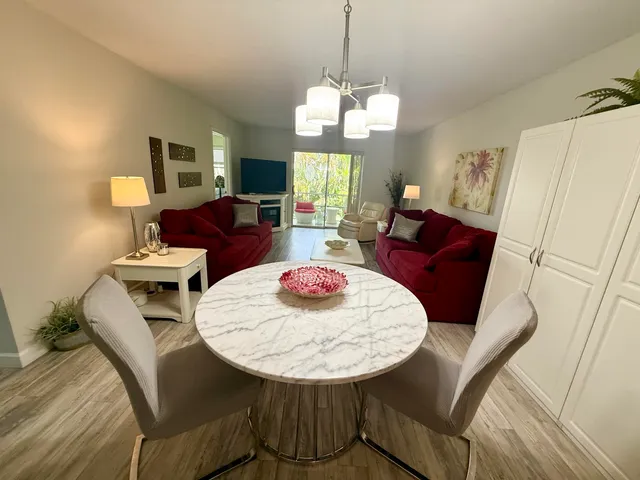 a view of a dining room with furniture and wooden floor