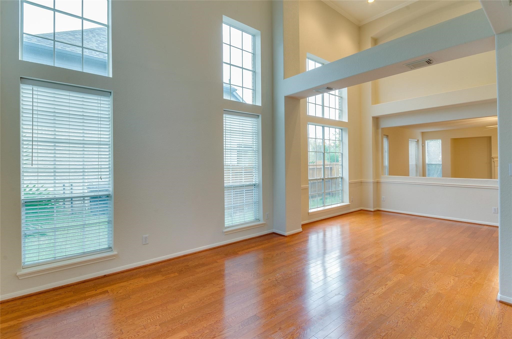 4019 Angel Spring Drive Sugar Land, TX 77479 - Photo 5 of 50 a view of an empty room with wooden floor and a window