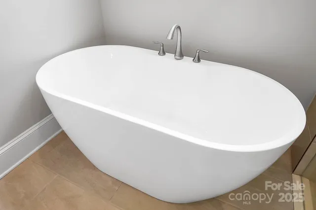 a white bath tub sitting in a bathroom