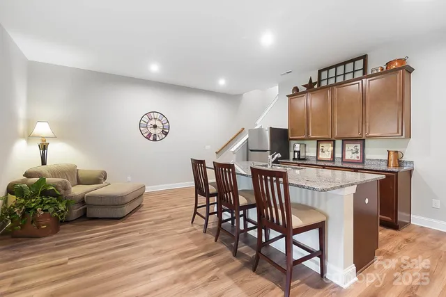a view of a livingroom with furniture and wooden floor