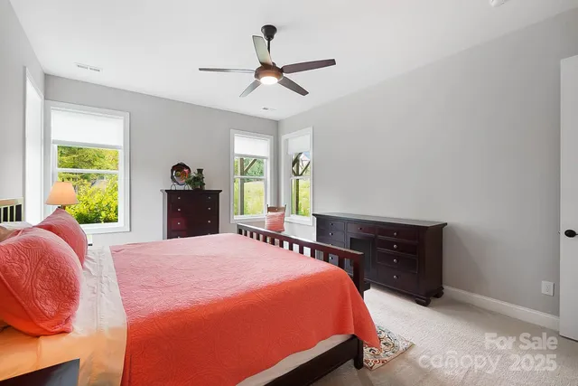 a bed room with a bed and a dresser